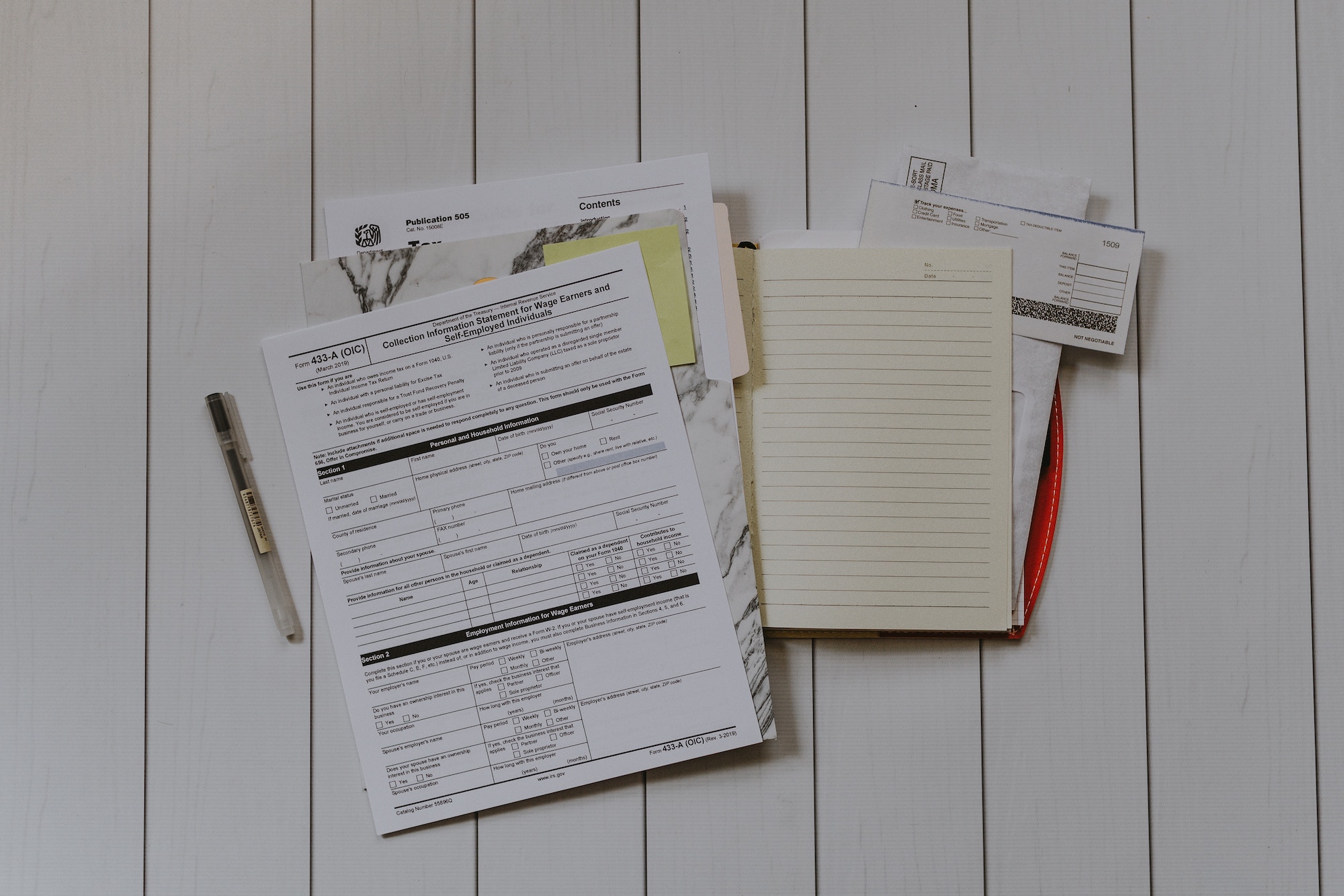 Professional photo taken of various tax documents and forums spread out