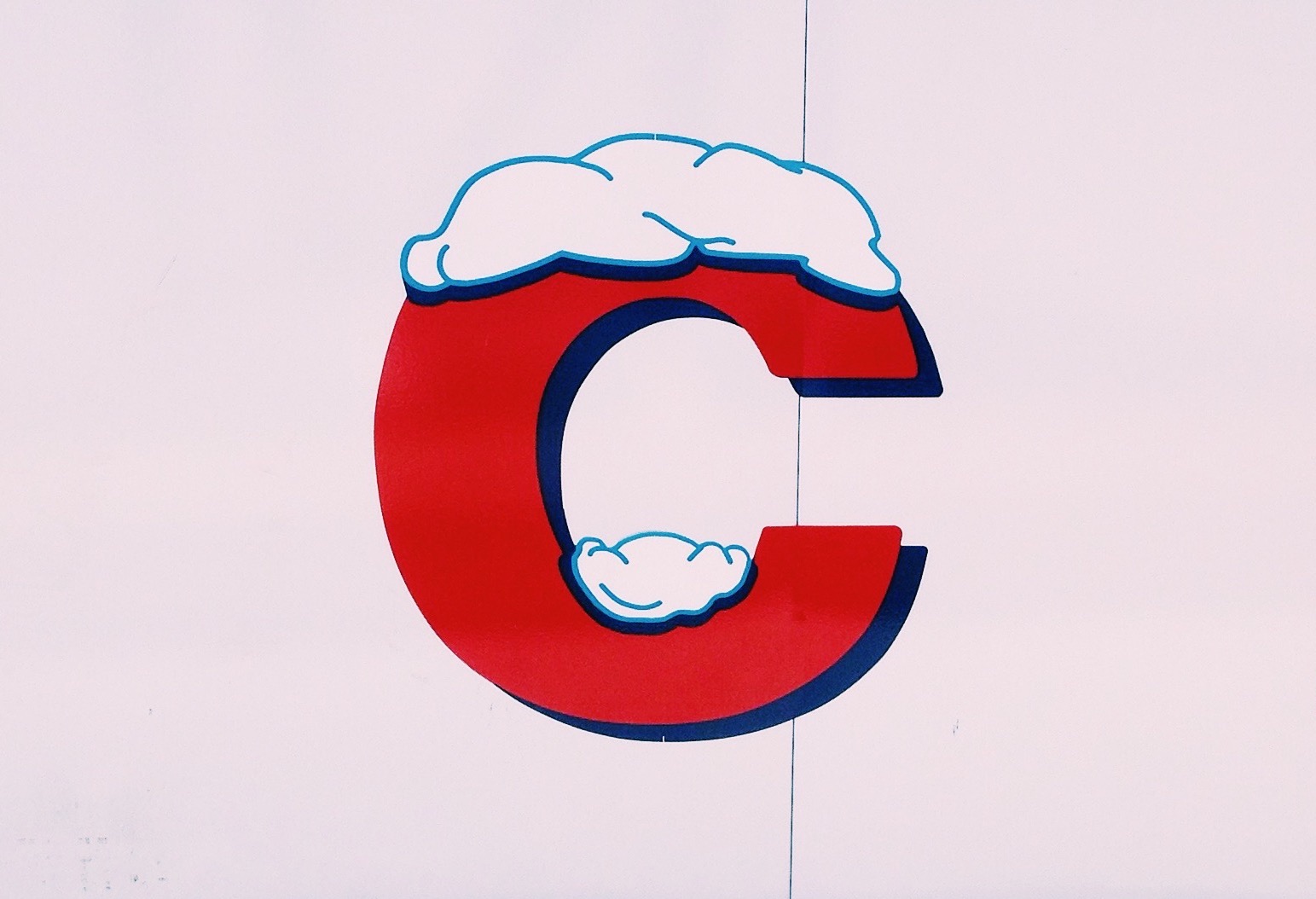 Giant red-colored letter C with snow on top made to represent the three Cs of credit